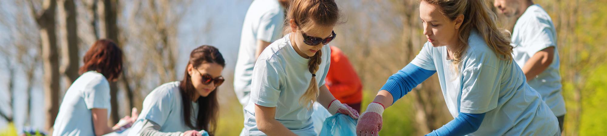 volunteers cleaning up a park